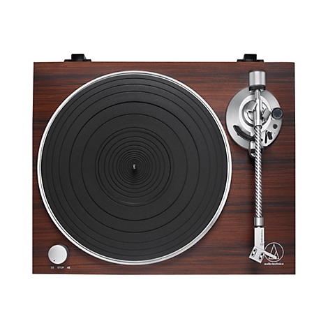 Draufsicht eines Audio-Technica Plattenspielers in Holzoptik mit schwarzem Plattenteller und silbernem Tonarm.