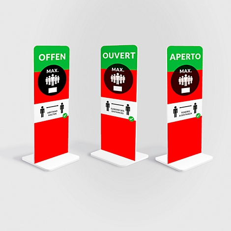 Drei Säulen mit den Worten: OFFEN, OUVERT, APERTO. Sie zeigen Symbole für Personen und Abstand. Rot, grün, weiss.