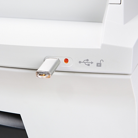 Close-up of white device with inserted USB-C connector and indicator lights.