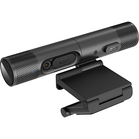 Schwarze zylindrische Webcam mit integriertem Standfuß und USB-C-Anschluss vor weißem Hintergrund.