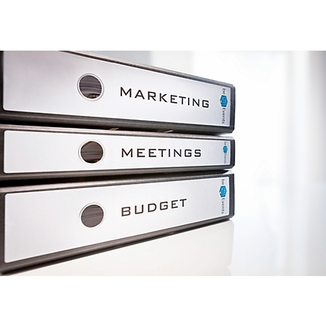 Three binders labeled: Marketing, Meetings, and Budget.