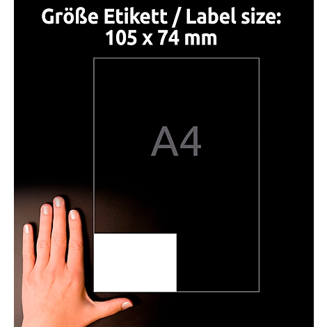 Hand holding a black sheet of paper, with a white label with the text 'A4'.