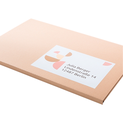 A package addressed to Julia Berger in Berlin. The shipping label features geometric shapes in pastel colors.