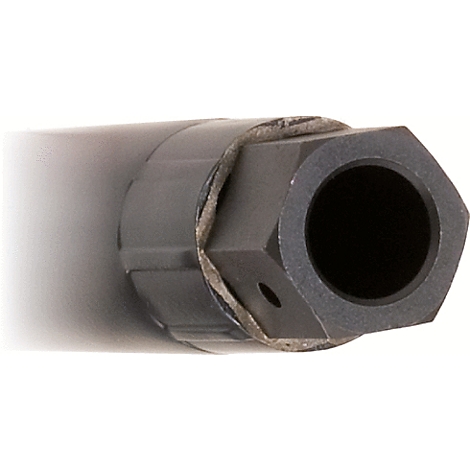 Nahes Detail eines schwarzen, sechseckigen Metallteils mit Loch und Innenraum.