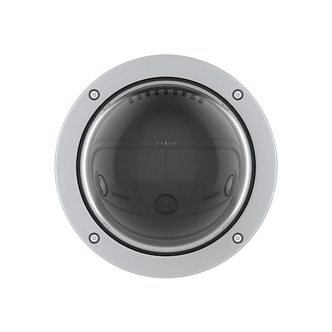 Gros plan sur une caméra de surveillance ronde et argentée avec un dôme en verre.