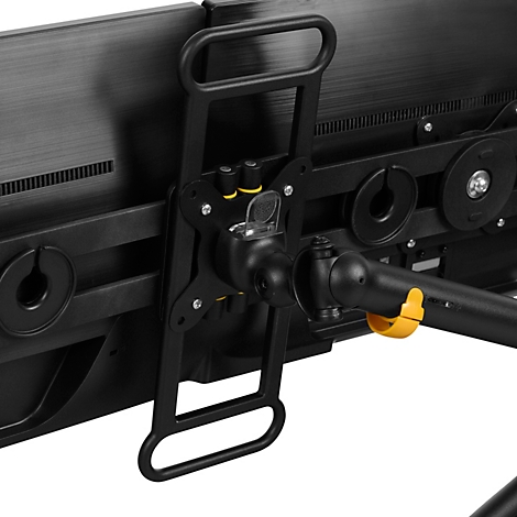 Detailaufnahme einer schwarzen Monitorhalterung mit gelben Akzenten.