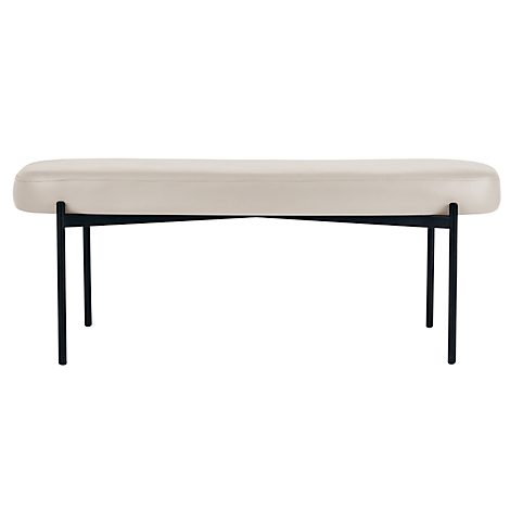 Beige bank met zwart metalen frame. Gewatteerde zitting, slanke poten.