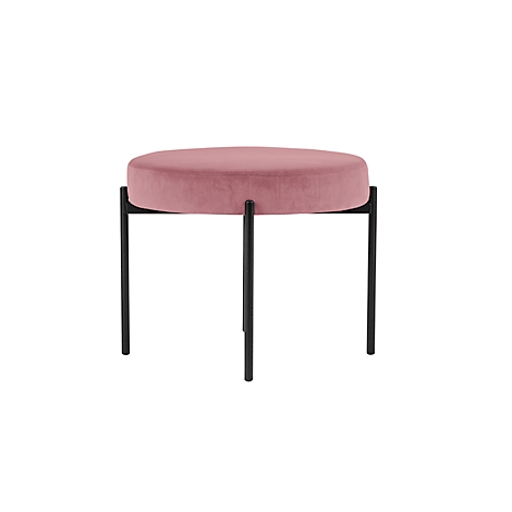 Ronde, roze fluwelen kruk met zwarte, minimalistische metalen poten.