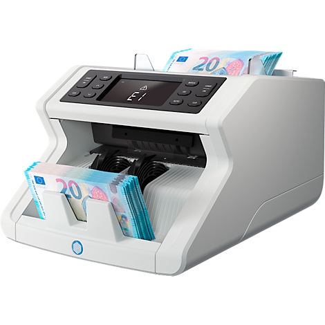 Banknote counting machine, into which banknotes are inserted. A bundle of banknotes is ready.