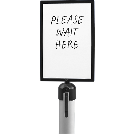 Sign with the text "PLEASE WAIT HERE". Black frame, white background. On a stand.