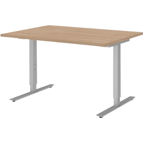 A height-adjustable desk with a wooden top and silver legs.
