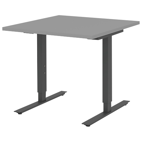 A grey, square desk with height-adjustable black legs. The table is freestanding.