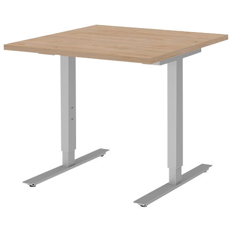 A square, height-adjustable desk with a wooden top and silver legs.
