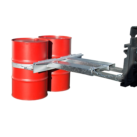Three red barrels are being transported by a forklift with a lifting device.