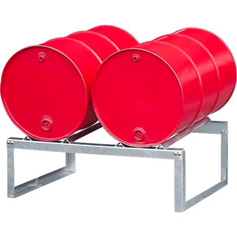 Red barrels on metal frame. Four red barrels are on the frame.
