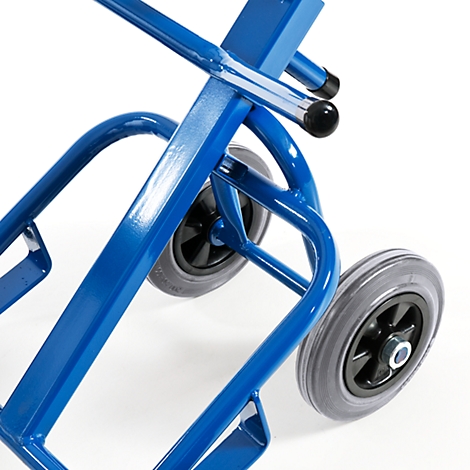 Close-up of a blue hand truck with gray tires and black rim.