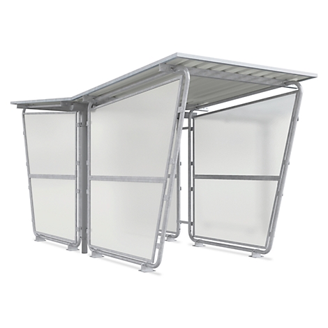 A grey, metal waiting shelter with transparent plastic walls and a roof. The shelter is free-standing.