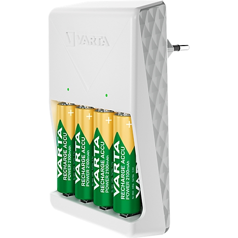 A white VARTA charger with four batteries inserted. The batteries are green and yellow with lettering. The charger is equipped with a power plug.