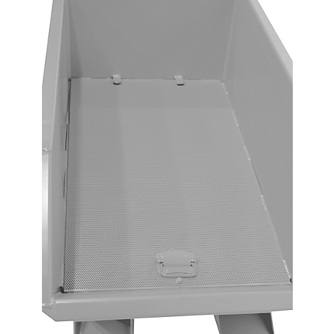 Gros plan d'un tiroir métallique gris avec un motif perforé et une poignée.