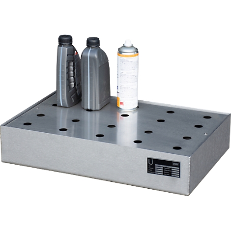 Silver drip tray with black oil bottles and spray can.