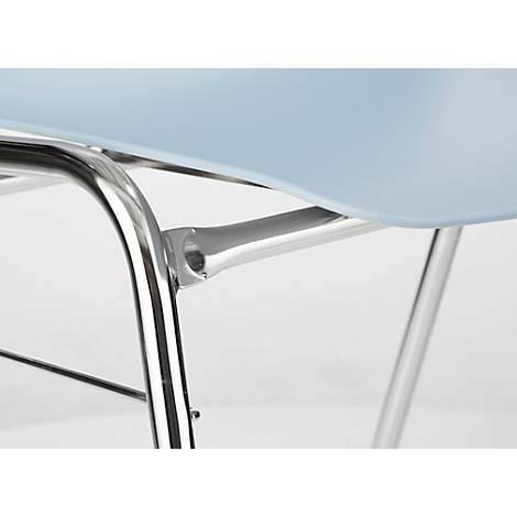 Close-up of the chrome metal chair frame supporting the seat, with a light blue plastic seat.