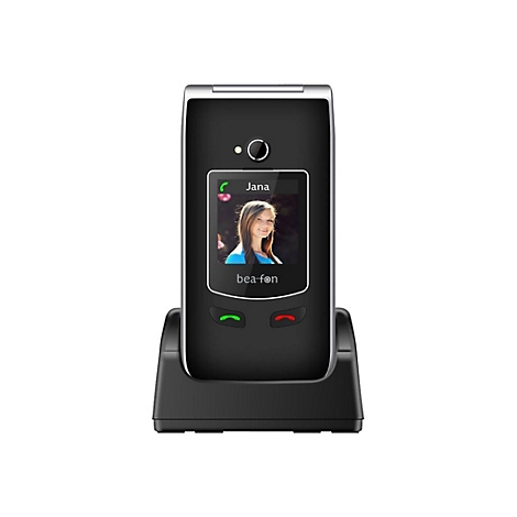 Schwarzes Klapptelefon in Ladestation. Auf dem Display ist eine Frau namens Jana zu sehen. Marke: bea-fon.