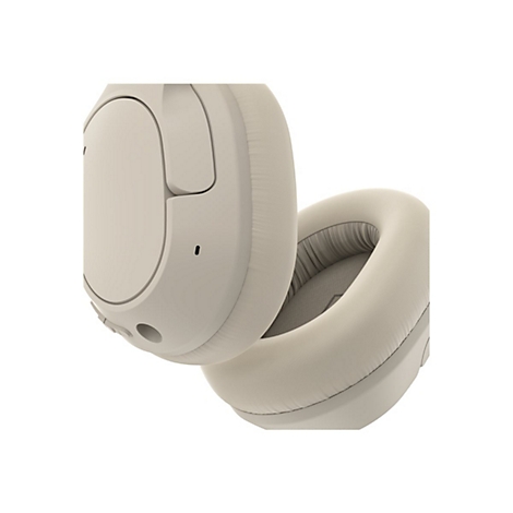 Casque beige, plan rapproché. Un écouteur est ouvert pour montrer la doublure intérieure.