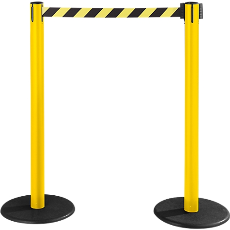 Yellow stanchions with black and yellow striped barrier tape. Both stanchions stand on black, round bases.