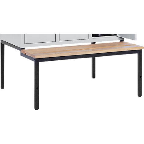 Wooden bench with black metal frame in front of a cabinet.