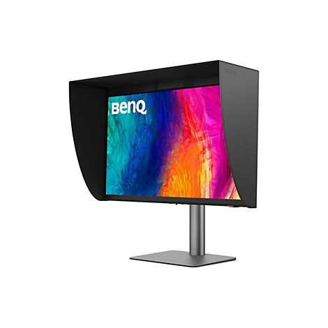 Monitor mit Blendschutzhaube. Der Bildschirm zeigt ein abstraktes, farbenfrohes Muster.