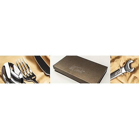 Besteck, Geschenkbox mit Schriftzug und Schraubenschlüssel auf beigem Stoff.