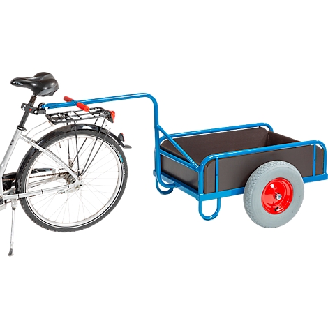 Bicycle with blue trailer. The trailer has a black loading area and a gray wheel with a red hub. The bicycle is partially visible.