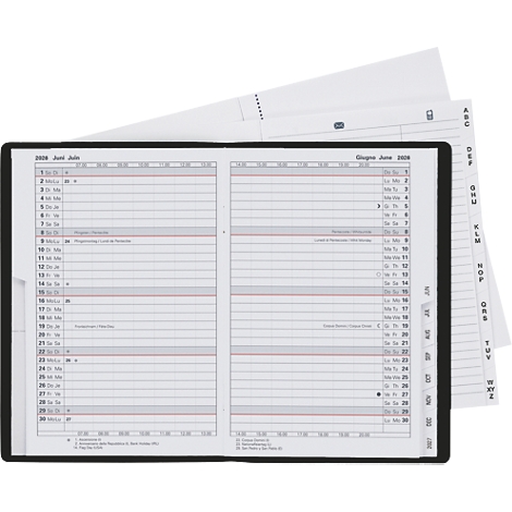 Un calendrier ouvert avec un cadre noir. Pages de calendrier et onglets.