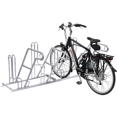 Bicycle in a galvanized bicycle rack. The bicycle has a black frame.