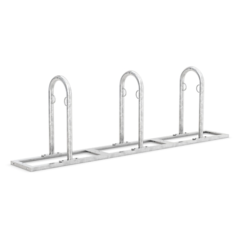 Metal bicycle rack. Three curved supports attached to a rectangular base.