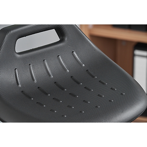 Close-up of the black seat of an office chair, featuring ventilation slots and a handle opening.