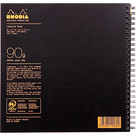Carnet Rhodia noir à spirale et logo jaune. Informations textuelles sur le grammage et les dimensions du papier sont visibles.