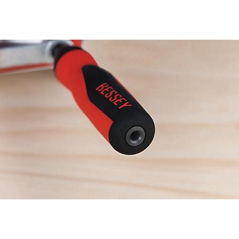 Close-up of a clamp handle, red and black, with the inscription "BESSEY".
