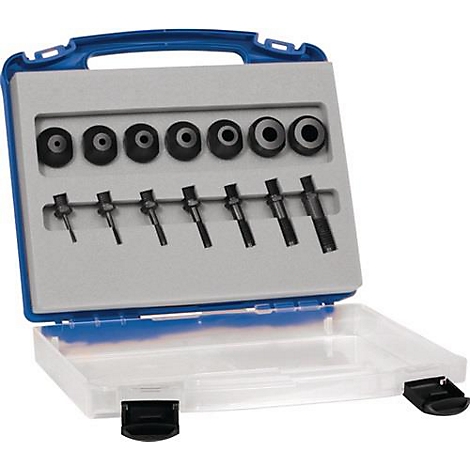 Boîte à outils avec divers outils noirs posés dans un lit en mousse grise, qui se trouve dans une boîte bleue et transparente.