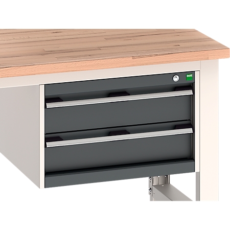 Werkbank met twee laden. Grijze laden met zilveren handgrepen, onder een houten blad.
