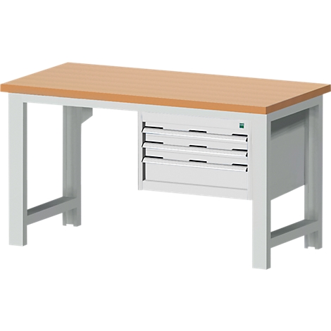 Een witte werkbank met een houten blad en laden.