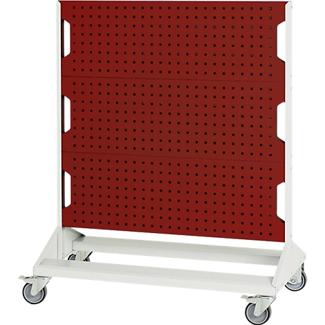 Rote Lochwand mit weißen Rahmen auf Rollen. Die Lochwand ist in drei Teile unterteilt.