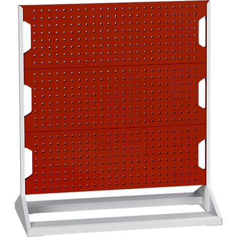 Rotes Lochblech auf weißem Gestell, mit Löchern und rechteckigen Aussparungen. Für Werkzeuge.