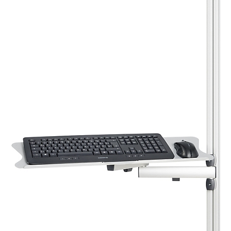 Clavier et souris noirs sur un support blanc fixé à un support blanc.