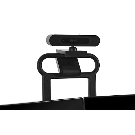 Webcam noire montée sur un support, fixée à un moniteur.