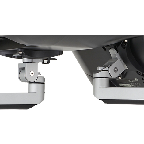 Vue détaillée du support articulé d'un moniteur. Construction métallique grise, vis et connexions clairement visibles.