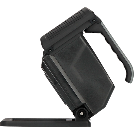 Schwarze Arbeitsleuchte mit Griff und Standfuß. Das Gehäuse ist kantig, der Griff ergonomisch geformt.