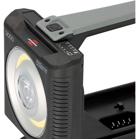 Nahaufnahme einer schwarzen Arbeitsleuchte mit LED-Licht. Ein grauer Griff, eine Einschalttaste und eine Batterieanzeige sind ebenfalls zu sehen.