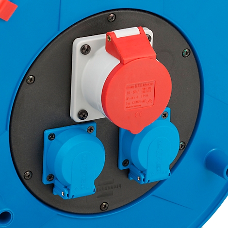 Gros plan d'un tambour bleu avec trois prises. Une prise rouge et blanche, deux prises bleues.