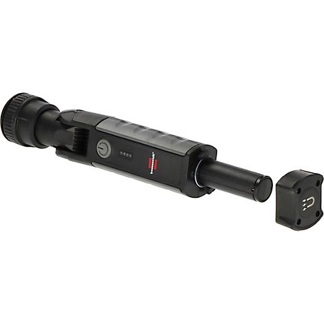 Une lampe d'inspection noire, partiellement démontée. Un bouton et un indicateur de charge sont visibles sur la poignée. Une partie détachable est à côté.